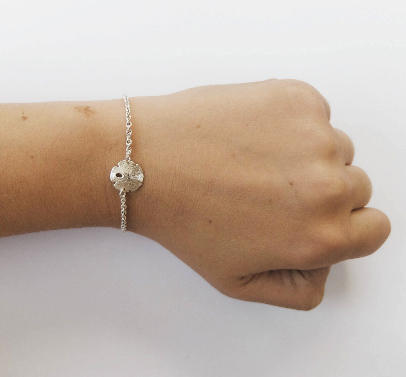 Silver sand dollar bracelet shop